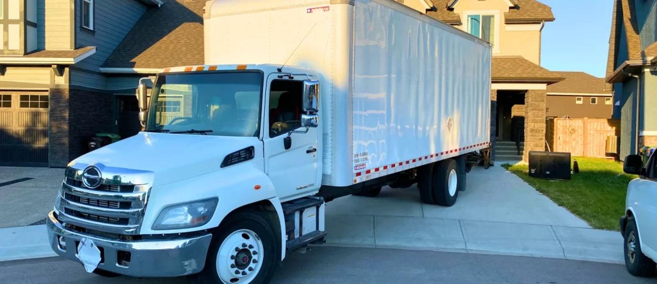 Same-day movers in Calgary loading a truck
